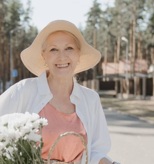 Best Elder Care For Your Loved Ones Woman Senior Carring Flowers - ElderlyCare X Webflow Template